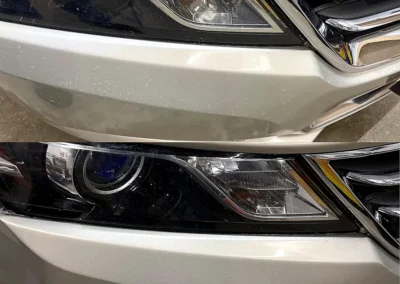 Before and after repair of paint chips and road rash on a champagne silver front bumper using the Dr. ColorChip paint chip repair system.